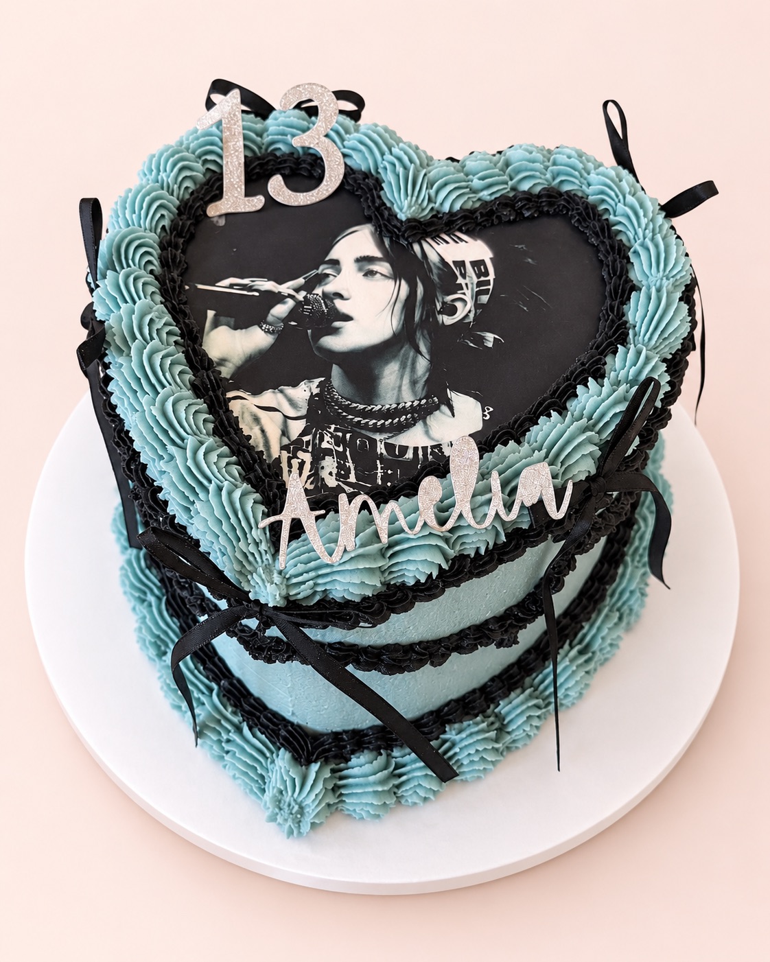 Blue and black vintage heart cake with an edible photo, a silver 13 topper and the name Amelia